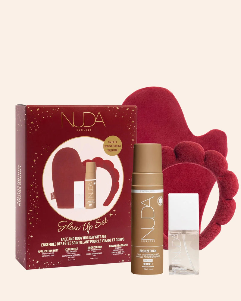 NUDA Skincare gift set with red packaging, red gloves, and skincare products on a beige background
