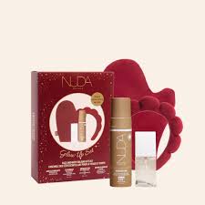 NUDA skincare product set with red box and gloves on a white background